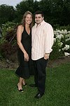 Adrienne and James Fauci at the  benefit for the NYU School of Medicine - Mental Illness Prevention Center hosted by Anna Anissimova at the Southampton residence of Denise Rich on August 14, 2004 at the Rich residence in Southampton, N.Y.<br>photo by Rob Rich copyright 2004 516-676-3939 robwayne1@aol.com