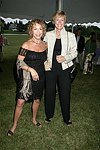 Shellie Caplan and Laura Scott  at the 8th. Annual Orchid Ball  to benefit the Child Developement Center of the Hamptons on July 24, 2004 at the Villa Maria in Watermill. photo by Rob Rich copyright 2004 516-676-3939  robwayne1@aol.com