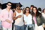 Frank Cilione, Kendall James, Tracey Brown, and Shamin Abas at the annual Hamptons Clambake at Flying Point Beach in Watermill on 7-11-04<br>photo by Rob Rich copyright 2004 516-676-3939 robwayne1@aol.com