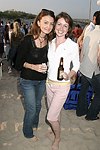 Nicole McElroy and Corrin Arasa at the annual Hamptons Clambake at Flying Point Beach in Watermill on 7-11-04<br>photo by Rob Rich copyright 2004 516-676-3939 robwayne1@aol.com