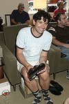 Andrew Escamilla trys on the merchandise at Swinging Saturday at Cole Haan in Easthampton on 8-14-04.  photo by Rob Rich copyright 2004 516-676-3939  robwayne1@aol.com