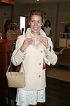 Annette Hanson trys on the merchandise  at Swinging Saturday at Cole Haan in Easthampton on 8-14-04.  photo by Rob Rich copyright 2004 516-676-3939  robwayne1@aol.com