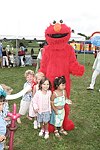 Elmo and the kids at the Albert Einstein College of Medicine's Family Day Carnival at the Villa Maria in Watermill on 8-15-04<br>  photo by Rob Rich copyright 2004 516-676-3939  robwayne1@aol.com