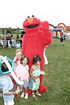 Elmo and the kids at the Albert Einstein College of Medicine's Family Day Carnival at the Villa Maria in Watermill on 8-15-04<br>  photo by Rob Rich copyright 2004 516-676-3939  robwayne1@aol.com