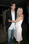Jonathan Cheban and Lizzy Grubman  at the G&P Fundraiser at the Southampton Residence of Denise Rich on  July 10, 2004<br> photo by Rob Rich copyright 2004 516-676-3939 robwayne1@aol.com