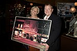 Brenda Siemer with highest bidder Michael Daley at JLXBistro for the &quotSave the Sign" benefit in Sag Harbor on 6-17-04. photo by Rob Rich copyright 2004<br>516-676-3939 robwayne1@aol.com<br>112 12th. AVe, Sea Cliff, N.Y.11579