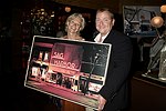 Brenda Siemer with highest bidder Michael Daley at JLXBistro for the &quotSave the Sign&quot benefit in Sag Harbor on 6-17-04. photo by Rob Rich copyright 2004<br>516-676-3939 robwayne1@aol.com<br>112 12th. AVe, Sea Cliff, N.Y.11579
