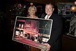 Brenda Siemer with highest bidder Michael Daley at JLXBistro for the &quotSave the Sign&quot benefit in Sag Harbor on 6-17-04. photo by Rob Rich copyright 2004<br>516-676-3939 robwayne1@aol.com<br>112 12th. AVe, Sea Cliff, N.Y.11579