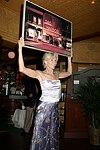 Brenda Siermer displays arytwork for auction at JLXBistro for the &quotSave the Sign" benefit in Sag Harbor on 6-17-04. photo by Rob Rich copyright 2004<br>516-676-3939 robwayne1@aol.com<br>112 12th. AVe, Sea Cliff, N.Y.11579