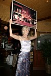 Brenda Siermer displays arytwork for auction at JLXBistro for the &quotSave the Sign&quot benefit in Sag Harbor on 6-17-04. photo by Rob Rich copyright 2004<br>516-676-3939 robwayne1@aol.com<br>112 12th. AVe, Sea Cliff, N.Y.11579