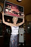 Brenda Siermer displays arytwork for auction at JLXBistro for the &quotSave the Sign&quot benefit in Sag Harbor on 6-17-04. photo by Rob Rich copyright 2004<br>516-676-3939 robwayne1@aol.com<br>112 12th. AVe, Sea Cliff, N.Y.11579