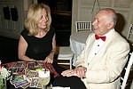 NEW YORK - JUNE 15: George Lang gets his tarot cards read  at the 80th.birthday celebration of famed restaruanteur GEORGE LANG at Cafe des Artistes<br>in Manhattan on June 15, 2004.<br>photo by Rob Rich copyright 2004 516-676-3939