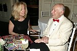 NEW YORK - JUNE 15: George Lang gets his tarot cards read  at the 80th.birthday celebration of famed restaruanteur GEORGE LANG at Cafe des Artistes<br>in Manhattan on June 15, 2004.<br>photo by Rob Rich copyright 2004 516-676-3939