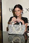 Nicky Hilton the launch of her handbag line on July 8, 2004  at Bloomingdale's Soho in Manhattan, N.Y. (Photo by Rob Rich/Everett Collection)