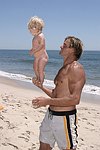 Reece Viola Hamilton with surfer dad Laird Hamilton<br> at the 'Riding Giants' beach party at the Watermill ocean front residence of Alex von Furstenberg on 7-3-04<br>photos by Rob Rich copyright 2004  516-676-3939