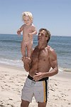 Reece Viola Hamilton with surfer dad Laird Hamilton<br> at the 'Riding Giants' beach party at the Watermill ocean front residence of Alex von Furstenberg on 7-3-04<br>photos by Rob Rich copyright 2004  516-676-3939