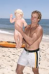 Reece Viola Hamilton with surfer dad Laird Hamilton<br> at the 'Riding Giants' beach party at the Watermill ocean front residence of Alex von Furstenberg on 7-3-04<br>photos by Rob Rich copyright 2004  516-676-3939