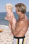 Reece Viola Hamilton with surfer dad Laird Hamilton<br> at the 'Riding Giants' beach party at the Watermill ocean front residence of Alex von Furstenberg on 7-3-04<br>photos by Rob Rich copyright 2004  516-676-3939