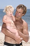 Reece Viola Hamilton with surfer dad Laird Hamilton<br> at the 'Riding Giants' beach party at the Watermill ocean front residence of Alex von Furstenberg on 7-3-04<br>photos by Rob Rich copyright 2004  516-676-3939
