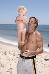 Reece Viola Hamilton with surfer dad Laird Hamilton<br> at the 'Riding Giants' beach party at the Watermill ocean front residence of Alex von Furstenberg on 7-3-04<br>photos by Rob Rich copyright 2004  516-676-3939